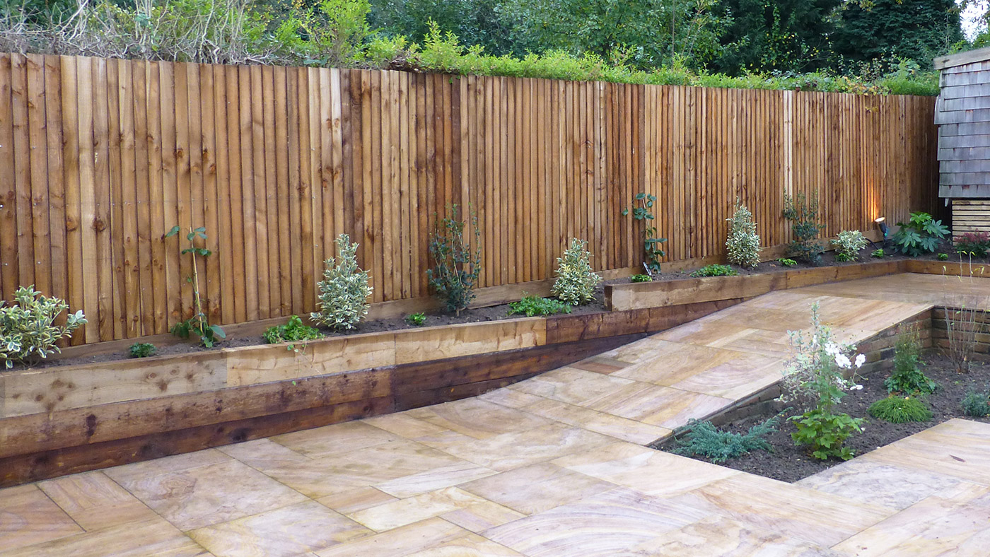 full view of garden from bottom level - steps, shed, lawn